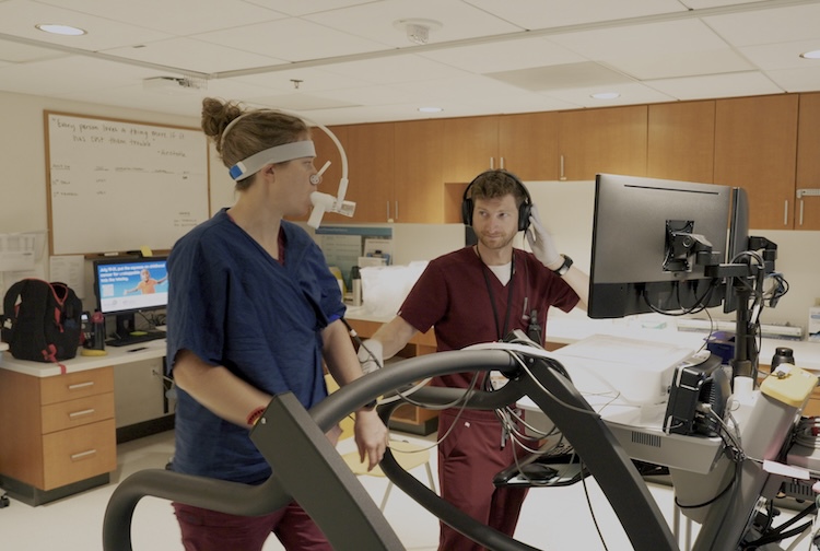 Brad Bakken working with patient on a treadmill at pauley heart center